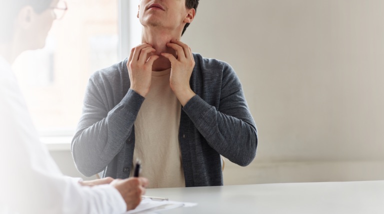 Eczema person scratching their neck