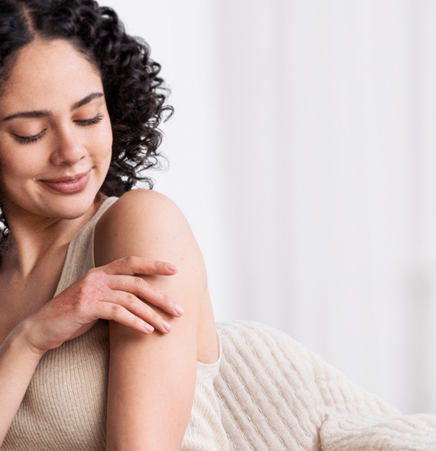 Woman touching her skin.